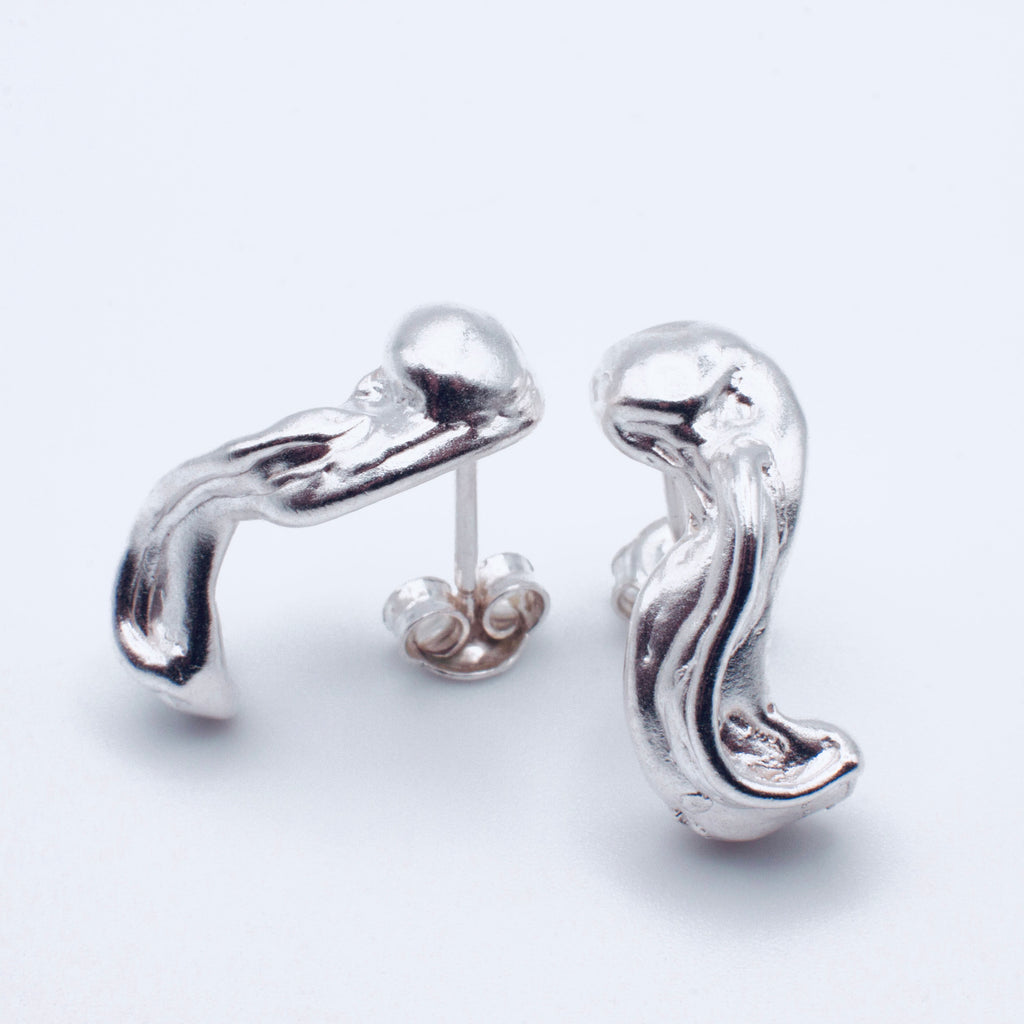 Silver hoop earrings on a white background