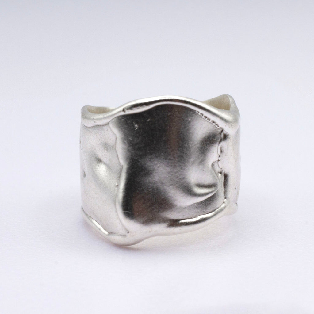 Silver ring on a white background